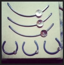 Silver pendants ready for their chains.